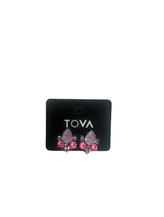 Pair of earrings on a Tova branded card against a white background