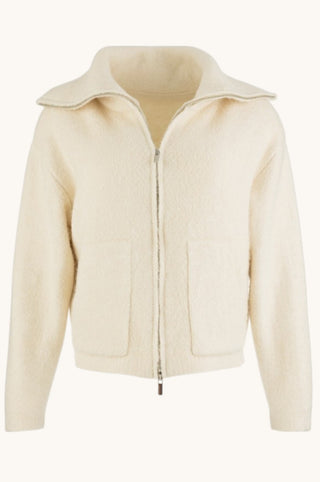 Cream-colored textured zip-up jacket with a wide collar and front pockets, shown on a plain off-white background.