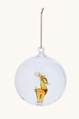A clear glass Christmas ornament shaped like a hanging moose, featuring a small amber-brown moose figure inside a transparent spherical frame with a silver hanging wire.