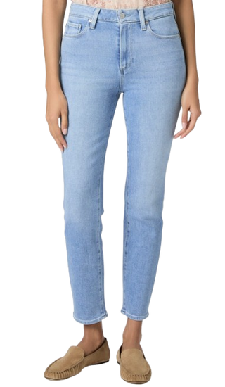 Light blue jeans worn by a person on a white background