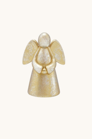 A small angel figurine with textured metallic gold and silver paint, standing with hands clasped in prayer against a plain off-white background.