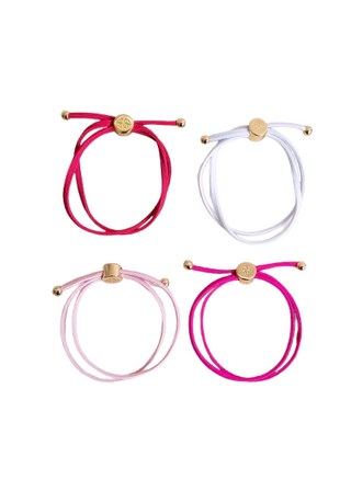 Four colorful bracelets with gold clasps on a white background